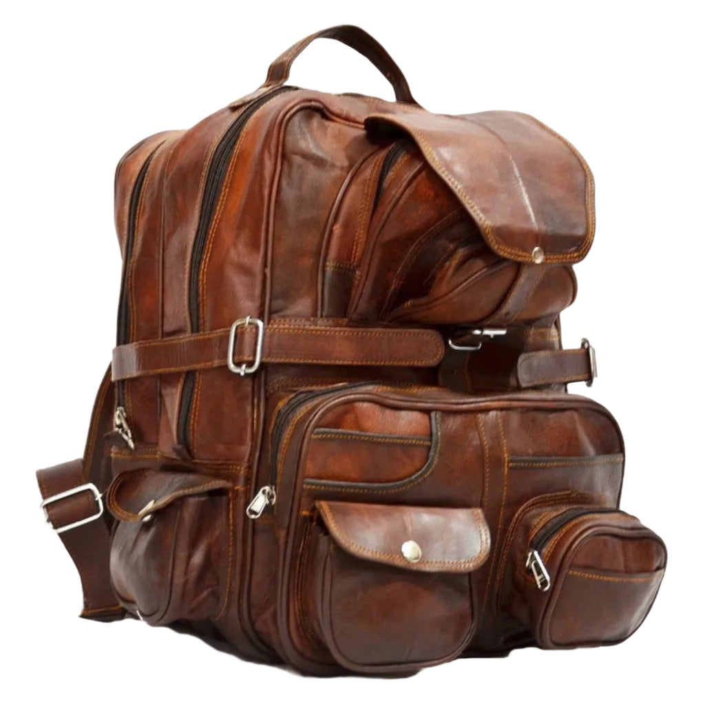 Brown leather backpack with multiple pockets and straps on a white background