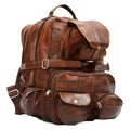Brown leather backpack with multiple pockets and straps on a white background