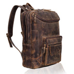 A distressed brown leather backpack with multiple zippered compartments, shown from a three-quarter angle on a white background with a subtle reflection.